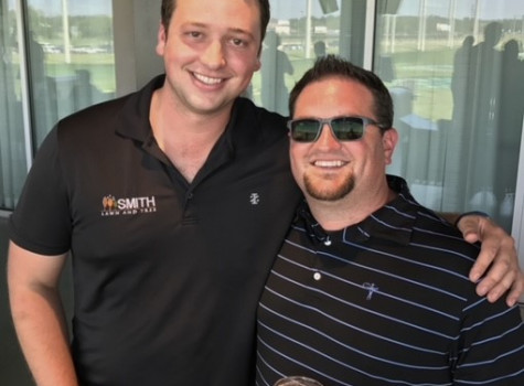 Team members loading equipment for a landscape install