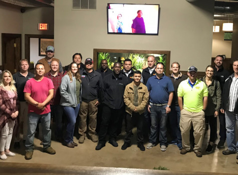 Crew planting seasonal flowers in a Dallas neighborhood